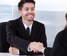 Smiling man shaking hands with someone